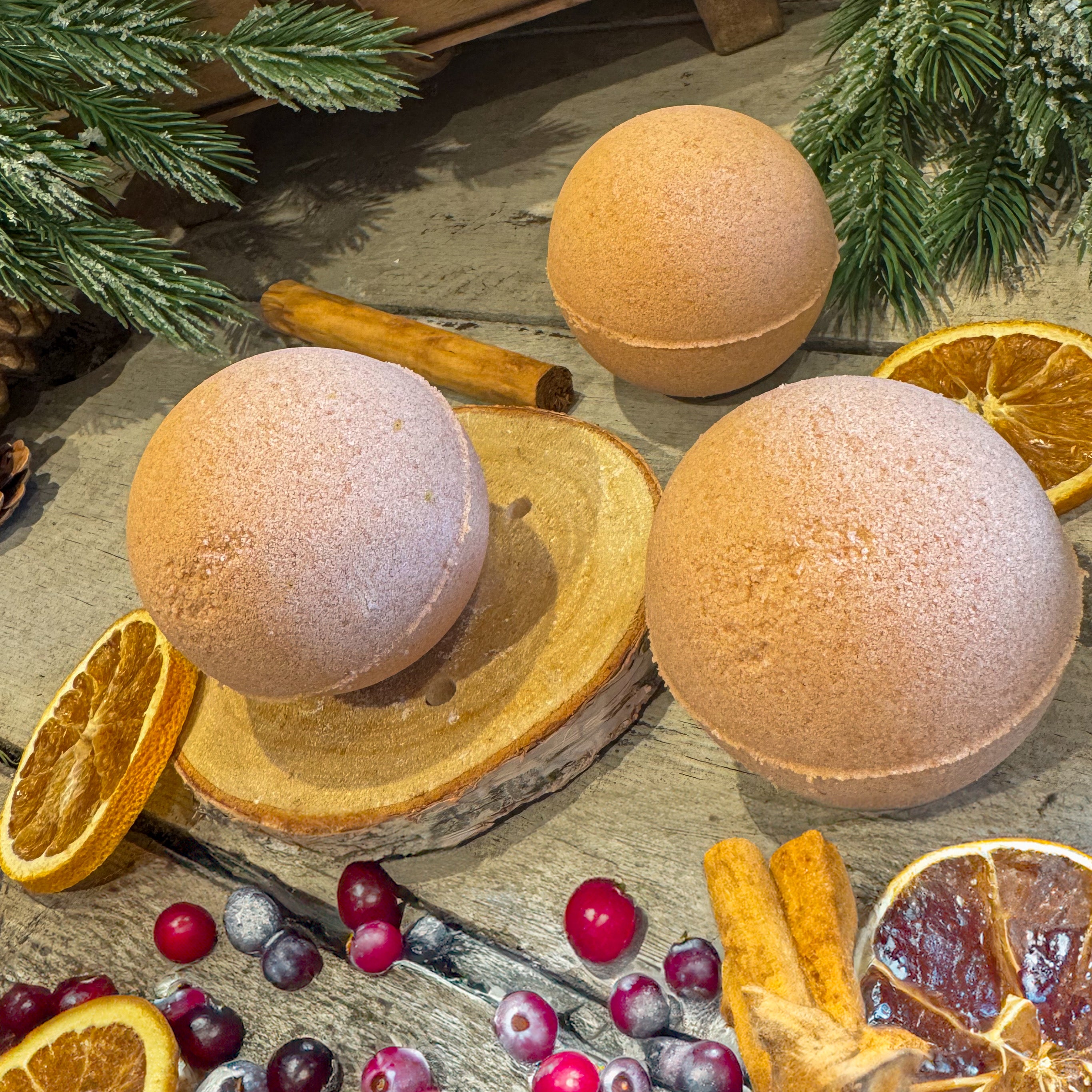 Orange, Cranberry & Cinnamon Bath Bomb - A festive blend of orange, cranberry, and spice with red clay for a naturally luxurious bath.