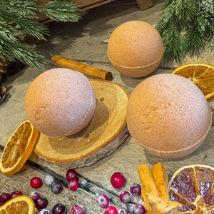 Orange, Cranberry & Cinnamon Bath Bomb - A festive blend of orange, cranberry, and spice with red clay for a naturally luxurious bath.